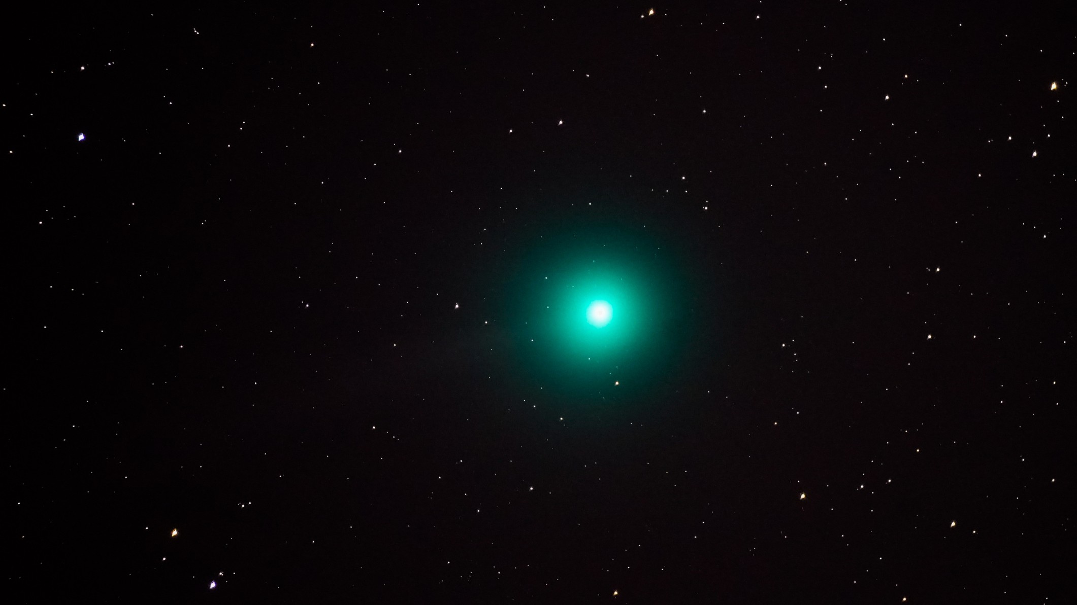 The green ball shines against the background of the stars.
