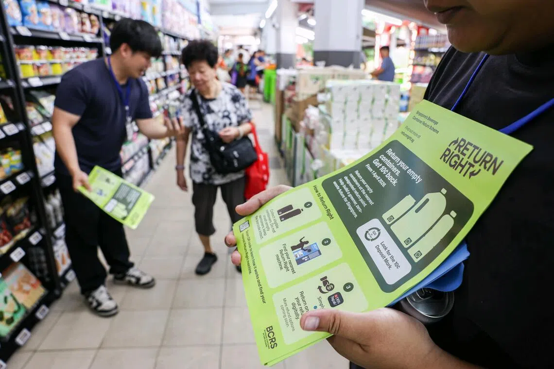 Program ambassadors are handing out flyers at Sheng Siong and Ang Mo Kio supermarkets as part of a six-month island-wide road show to inform residents about the recycling initiative.