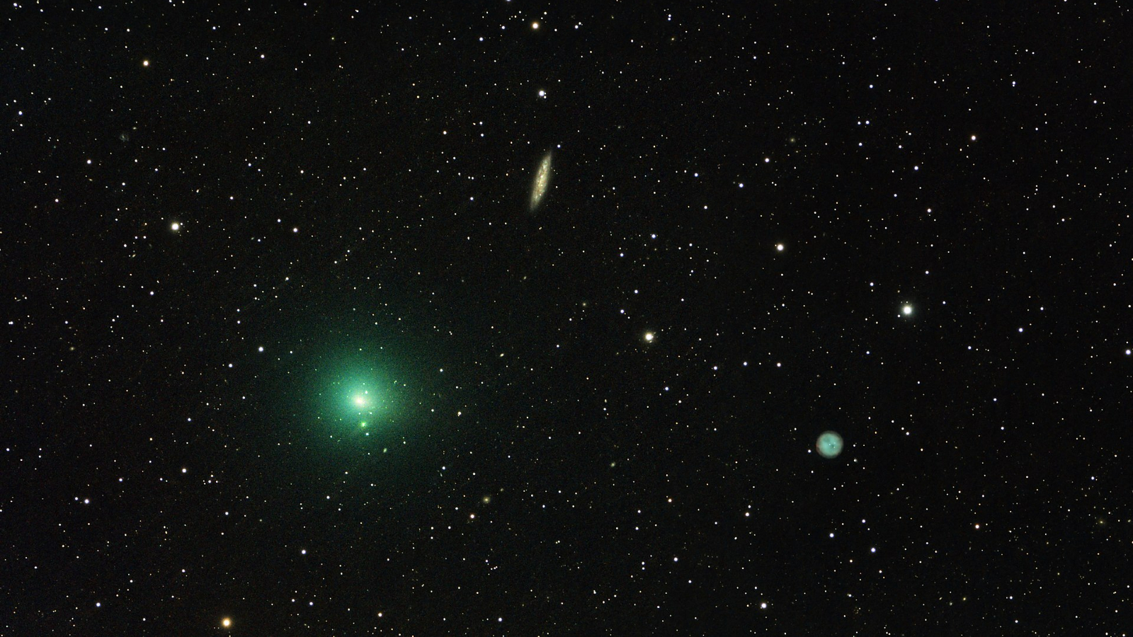 Photo of a green comet in a starry sky