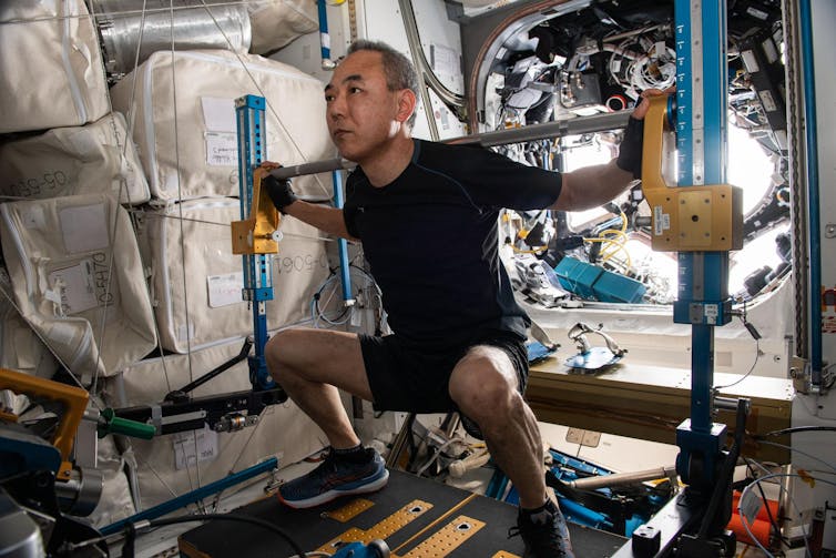 Japanese astronaut Satoshi Furukawa works on the International Space Station.