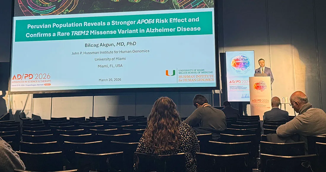 A conference hall view showing a presentation slide titled