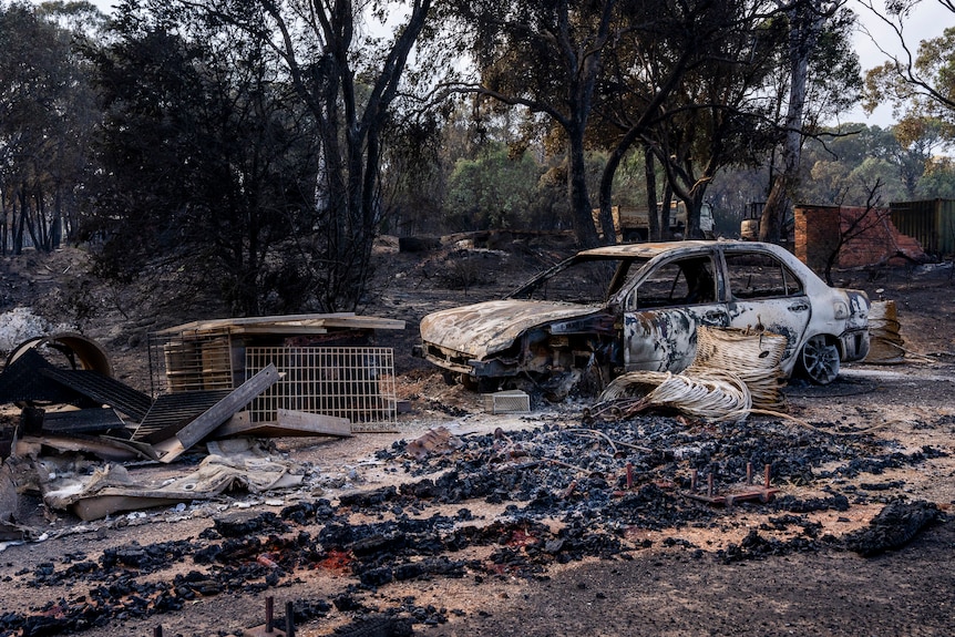The white car was completely destroyed by fire